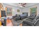 Bedroom with two windows, a ceiling fan, hardwood floors and furnishings at 488 Russell Rd, Lawrenceville, GA 30043
