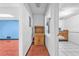 Hallway area with cabinet and counter space leading to multiple rooms at 488 Russell Rd, Lawrenceville, GA 30043
