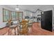 Bright eat-in kitchen features white cabinets, stainless steel appliances, and a breakfast nook at 488 Russell Rd, Lawrenceville, GA 30043