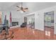 Spacious living room features tile floors, a ceiling fan, and a cozy fireplace at 488 Russell Rd, Lawrenceville, GA 30043