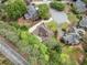 Aerial shot showcases a neighborhood home surrounded by lush greenery and mature trees offering a private setting at 674 Owl Creek Ct, Powder Springs, GA 30127