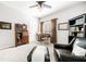 Bedroom showcases a wood bureau, desk and chair, neutral carpet and matching window curtains at 674 Owl Creek Ct, Powder Springs, GA 30127