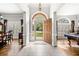 Inviting foyer with tile flooring, an arched doorway, and views of the living spaces beyond at 674 Owl Creek Ct, Powder Springs, GA 30127
