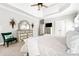 Spacious main bedroom with a ceiling fan, trey ceiling, and a decorative dresser at 674 Owl Creek Ct, Powder Springs, GA 30127