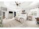 This is the primary bedroom featuring tray ceilings, carpet and a neutral color scheme at 674 Owl Creek Ct, Powder Springs, GA 30127