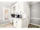 Office area featuring built-in cabinets, a desk, and natural light at 674 Owl Creek Ct, Powder Springs, GA 30127