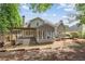Beautiful backyard features a covered patio, a screened in porch and a gravel area at 7020 Grand View Way, Suwanee, GA 30024