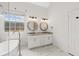 Bright and airy bathroom featuring dual sinks and a soaking tub at 7020 Grand View Way, Suwanee, GA 30024