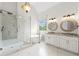 Bright and airy bathroom featuring dual sinks, a soaking tub, and a glass-enclosed shower at 7020 Grand View Way, Suwanee, GA 30024