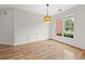 Bright dining room with hardwood floors and wainscoting at 7020 Grand View Way, Suwanee, GA 30024