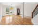 Dining room featuring hardwood floors, wainscoting, and light fixture at 7020 Grand View Way, Suwanee, GA 30024
