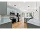 Bright kitchen with updated cabinets, marble countertops and stainless steel appliances at 7020 Grand View Way, Suwanee, GA 30024