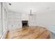 Bright living room with built-in shelves, stone fireplace, and hardwood floors at 7020 Grand View Way, Suwanee, GA 30024