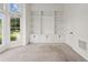 Office with built-in bookshelves and bright windows at 7020 Grand View Way, Suwanee, GA 30024