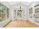 Bright sunroom with many windows and a glass paned door to outside at 7020 Grand View Way, Suwanee, GA 30024