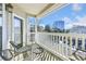 Cozy balcony retreat featuring outdoor seating and a view of the city skyline surrounded by trees at 1250 Parkwood Se Cir # 300, Atlanta, GA 30339