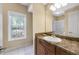 This bathroom features a solid surface vanity top with a bright window and updated lighting at 1250 Parkwood Se Cir # 300, Atlanta, GA 30339