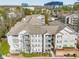 Inviting condo complex with multiple balconies, lush landscaping, and views of surrounding community buildings at 1250 Parkwood Se Cir # 300, Atlanta, GA 30339