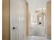 View of the hallway into the living room with beige walls and carpet, and white doors and ceilings at 1250 Parkwood Se Cir # 300, Atlanta, GA 30339