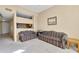 Living room showcasing neutral walls and carpet, complemented by a cozy kitchen view in the background at 1250 Parkwood Se Cir # 300, Atlanta, GA 30339