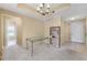 Spacious open living room with carpeted floors, tan walls, and natural light shining through the window at 1250 Parkwood Se Cir # 300, Atlanta, GA 30339