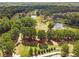 This aerial view shows a beautiful golf course with mature trees, water features, and well-maintained fairways at 2019 Emerald Dr, Jonesboro, GA 30236