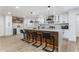 Modern kitchen featuring a wine cooler, bright cabinets, marble counters, stylish hardware, and a decorative backsplash at 2019 Emerald Dr, Jonesboro, GA 30236
