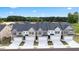 An aerial view of townhomes shows manicured lawns, paved driveways, and newly built exteriors at 349 Elgin Dr, Lawrenceville, GA 30045