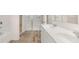 Bathroom with double sinks, a soaking tub, and a glass shower at 349 Elgin Dr, Lawrenceville, GA 30045