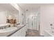 Spacious bathroom featuring a double vanity, separate shower, and soaking tub at 349 Elgin Dr, Lawrenceville, GA 30045