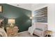 Cozy bedroom seating area with comfortable chair, table and neutral color palette at 349 Elgin Dr, Lawrenceville, GA 30045