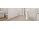 Bright hallway with wood floors and a half bath at 349 Elgin Dr, Lawrenceville, GA 30045