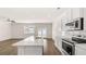 Modern kitchen with white cabinets, stainless steel appliances, and a functional island with barstool seating at 349 Elgin Dr, Lawrenceville, GA 30045