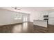 Spacious living area featuring a modern kitchen, dining area, and stylish wood flooring at 349 Elgin Dr, Lawrenceville, GA 30045