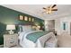 Stylish main bedroom with a tray ceiling, a ceiling fan and elegant furnishings at 349 Elgin Dr, Lawrenceville, GA 30045
