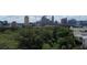 A serene aerial view showcasing lush green trees and the city skyline in the background at 3667 Peachtree Ne Rd # 6, Atlanta, GA 30319