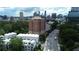 Beautiful aerial view of city skyline, trees, roads, and nearby buildings around the property at 3667 Peachtree Ne Rd # 6, Atlanta, GA 30319