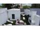 An aerial view showcases the rooftop terrace, complete with seating, an outdoor TV, and a fireplace at 3667 Peachtree Ne Rd # 6, Atlanta, GA 30319