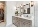 A well-lit primary bath offers double sinks, modern fixtures, and quartz countertops at 3667 Peachtree Ne Rd # 6, Atlanta, GA 30319