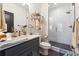 Modern bathroom features glass shower door, bronze fixtures, and sleek vanity at 3667 Peachtree Ne Rd # 6, Atlanta, GA 30319