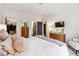 Bright bedroom featuring an ensuite bathroom, walk-in closet, and two dressers for ample storage at 3667 Peachtree Ne Rd # 6, Atlanta, GA 30319
