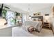 A sun-drenched bedroom is decorated with a plush rug, seating, and contemporary furniture at 3667 Peachtree Ne Rd # 6, Atlanta, GA 30319