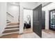Inviting entryway with a staircase and decorative storage, offering a warm welcome to the home at 3667 Peachtree Ne Rd # 6, Atlanta, GA 30319