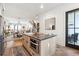 Open kitchen view featuring a built-in microwave, large island, open-concept access to the dining and living room, and outdoor views at 3667 Peachtree Ne Rd # 6, Atlanta, GA 30319