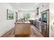 Modern kitchen boasts stainless steel appliances, island with seating, stylish gray and white cabinetry, and a bright window at 3667 Peachtree Ne Rd # 6, Atlanta, GA 30319