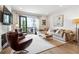 Bright living room features a fireplace, comfortable seating, and a balcony overlooking the surrounding area at 3667 Peachtree Ne Rd # 6, Atlanta, GA 30319