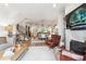 Open-concept living room flows seamlessly into the dining area, showcasing modern decor and hardwood floors at 3667 Peachtree Ne Rd # 6, Atlanta, GA 30319