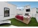 Outdoor living space with a fireplace and a lounge on the rooftop deck at 3667 Peachtree Ne Rd # 6, Atlanta, GA 30319