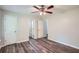 Bedroom featuring a ceiling fan, two closets and ensuite bathroom access at 7112 Greenway Sw Cv, Covington, GA 30014