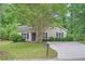 Inviting single-story home with a well-kept lawn and neutral siding at 7112 Greenway Sw Cv, Covington, GA 30014
